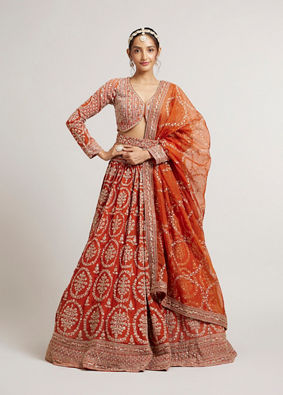 Mohey Women Rust Orange Floral Medallion Patterned Lehenga with Bel Buti Embroidery on Blouse