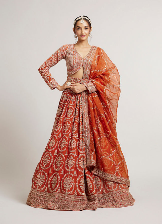 Mohey Women Rust Orange Floral Medallion Patterned Lehenga with Bel Buti Embroidery on Blouse