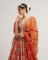 Mohey Women Rust Orange Floral Medallion Patterned Lehenga with Bel Buti Embroidery on Blouse