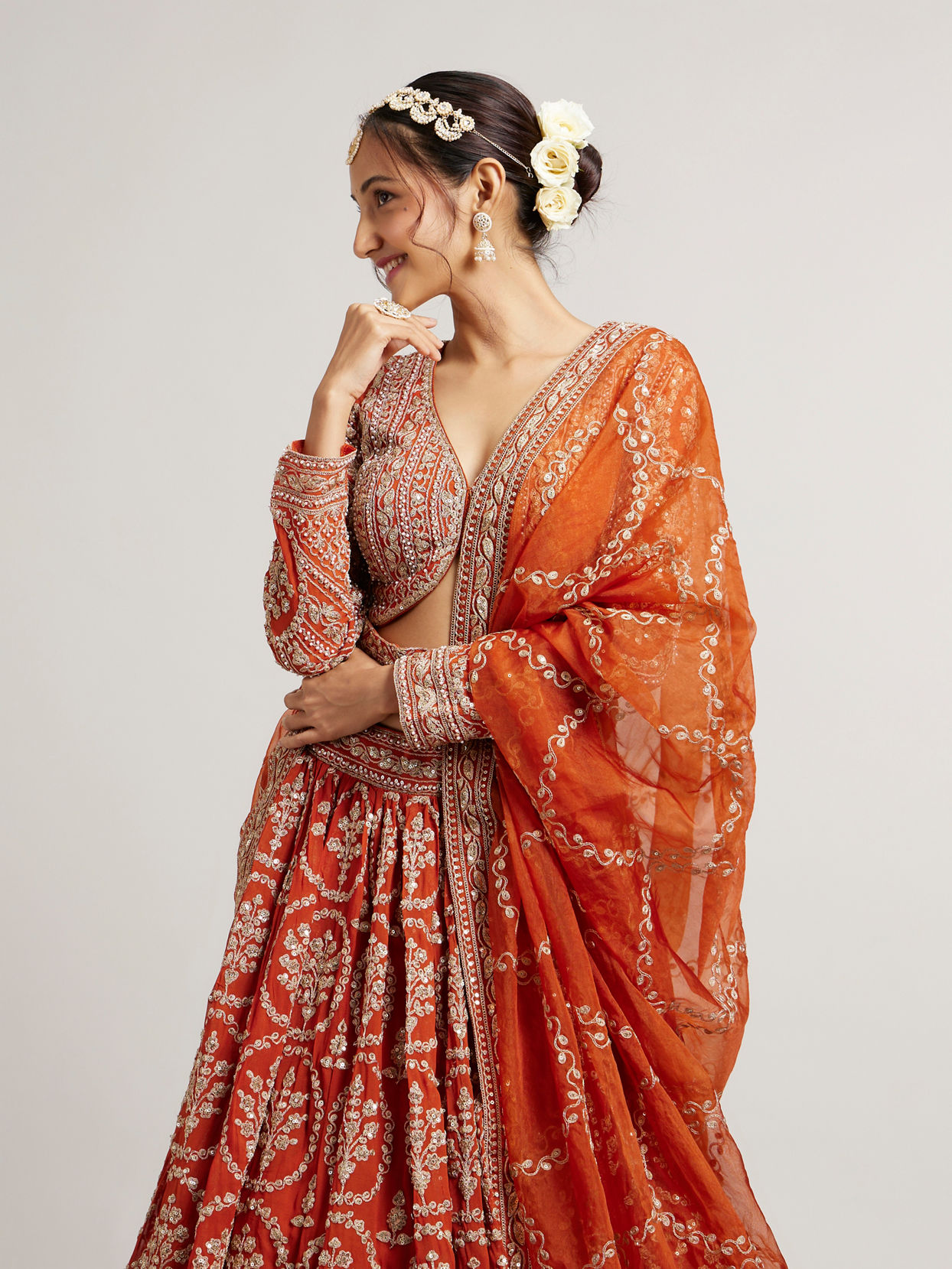 Mohey Women Rust Orange Floral Medallion Patterned Lehenga with Bel Buti Embroidery on Blouse