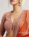 Mohey Women Rust Orange Floral Medallion Patterned Lehenga with Bel Buti Embroidery on Blouse