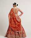 Mohey Women Rust Orange Floral Medallion Patterned Lehenga with Bel Buti Embroidery on Blouse