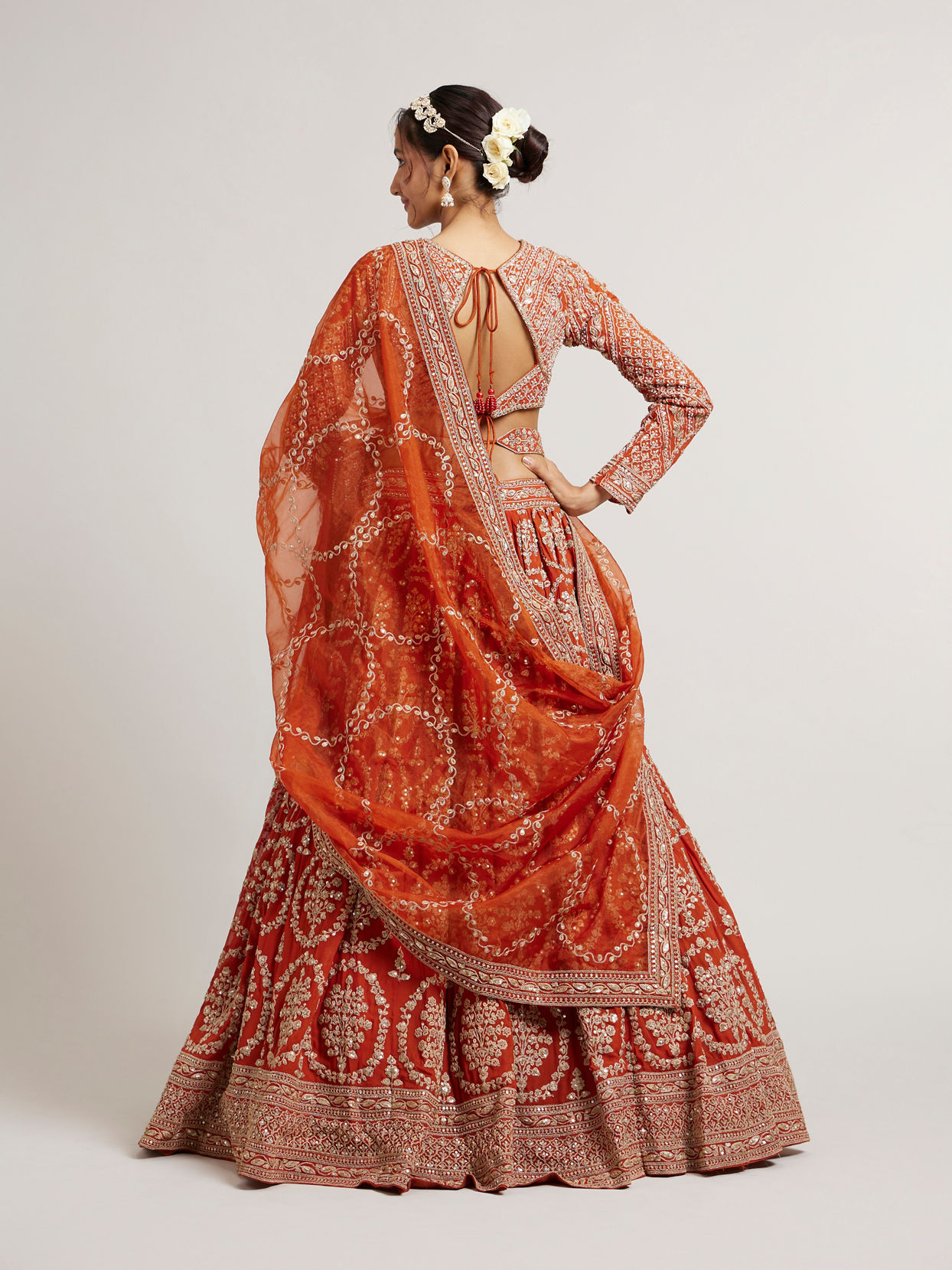 Mohey Women Rust Orange Floral Medallion Patterned Lehenga with Bel Buti Embroidery on Blouse
