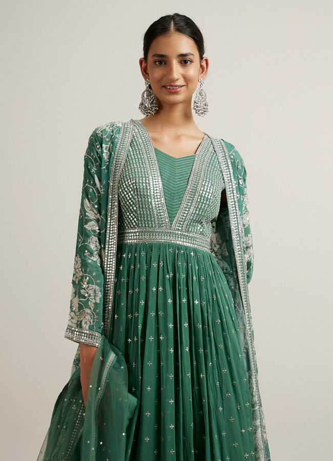 alt message - Mohey Women Green Bel Buti Patterned Stitched Suit with Jacket Cape image number 1