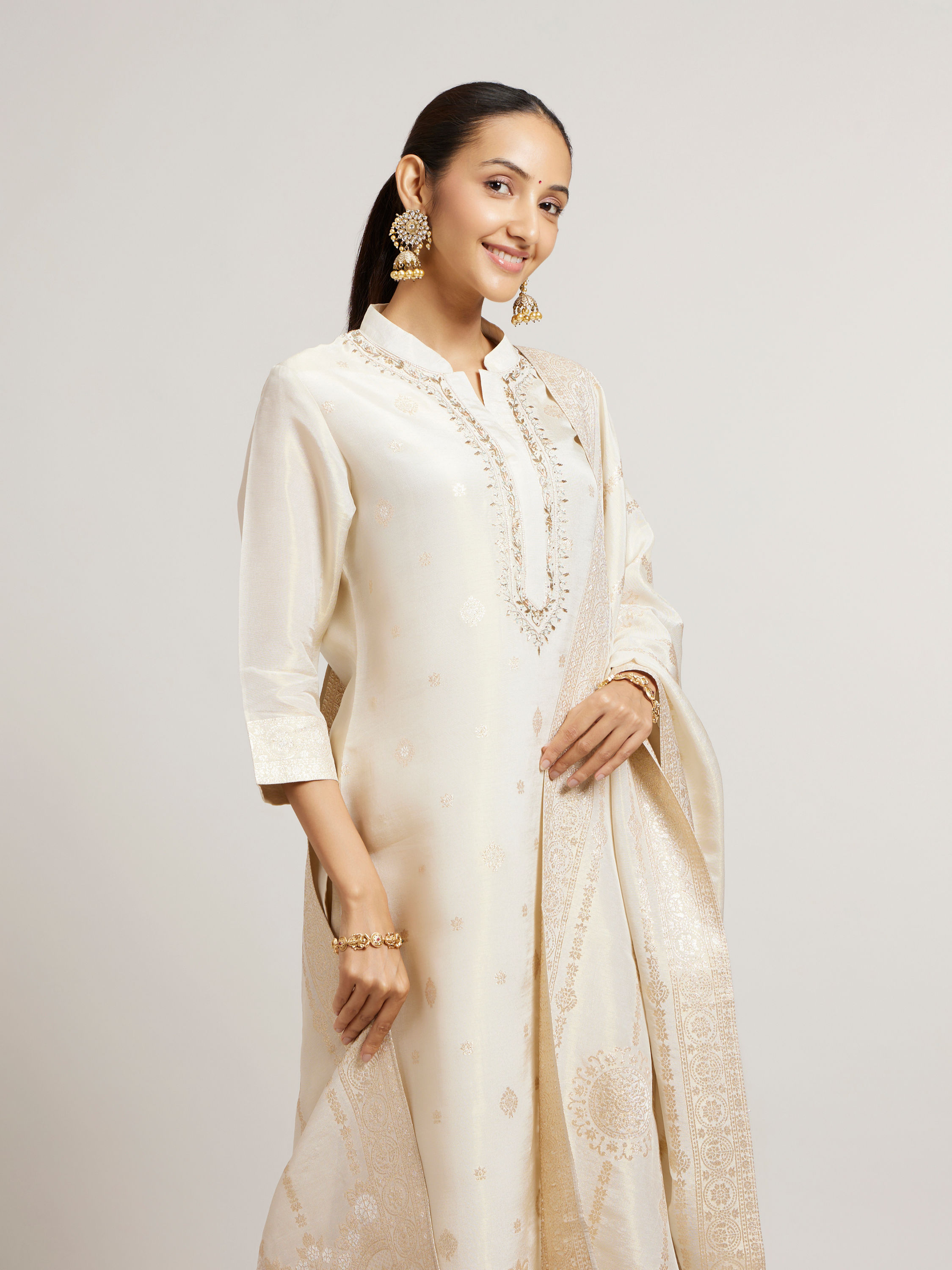 Mohey Women Soft Cream Straight Suit Set with Buta Pattern in Dull Gold Zari Work