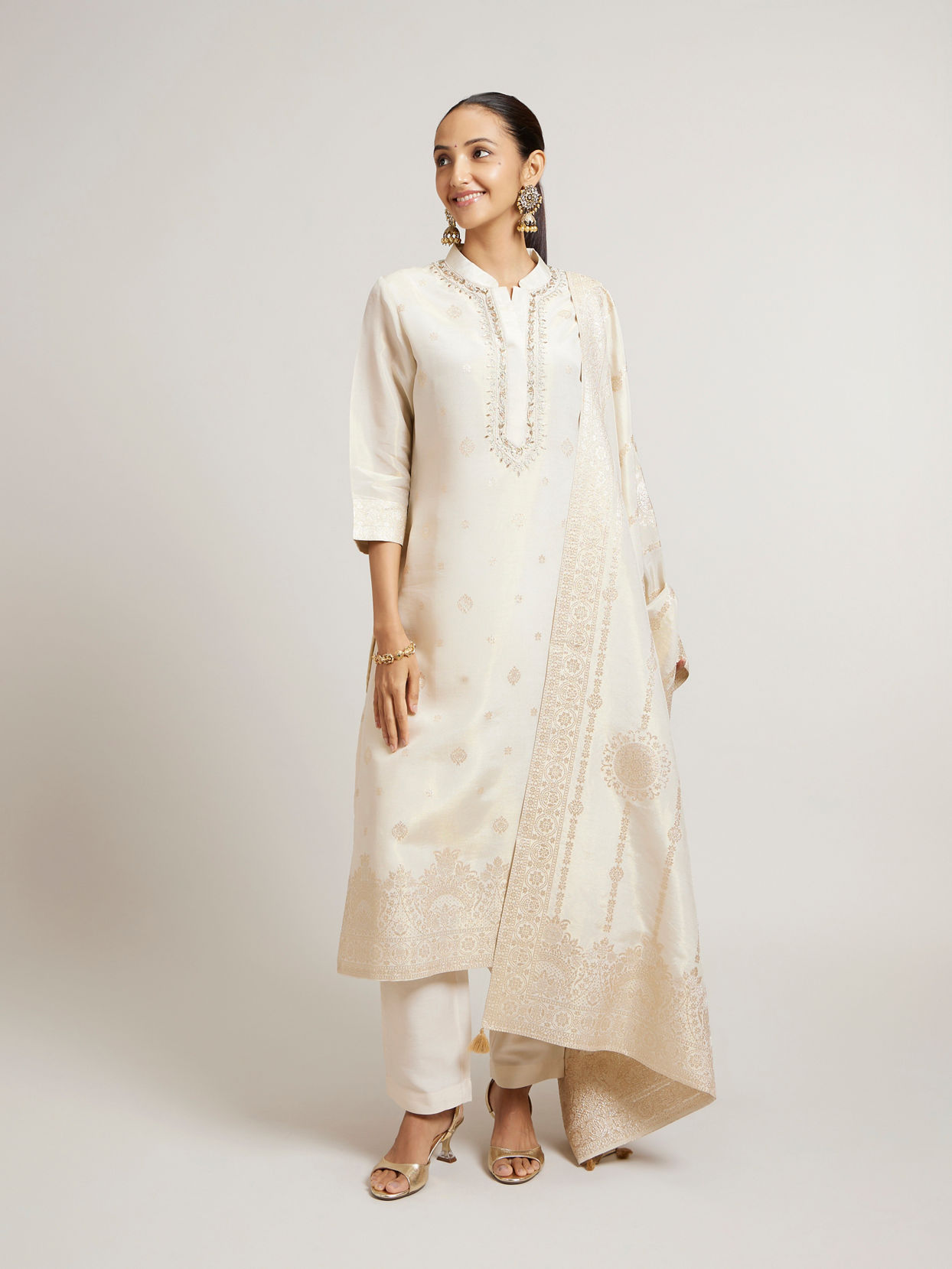 Mohey Women Soft Cream Straight Suit Set with Buta Pattern in Dull Gold Zari Work