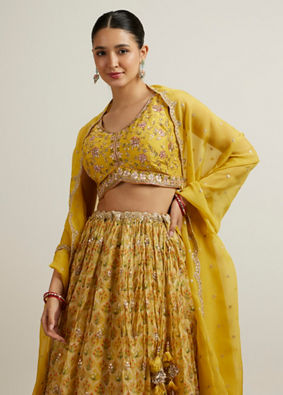 alt message - Mohey Women Glistening Yellow Radiance Lehenga image number 1