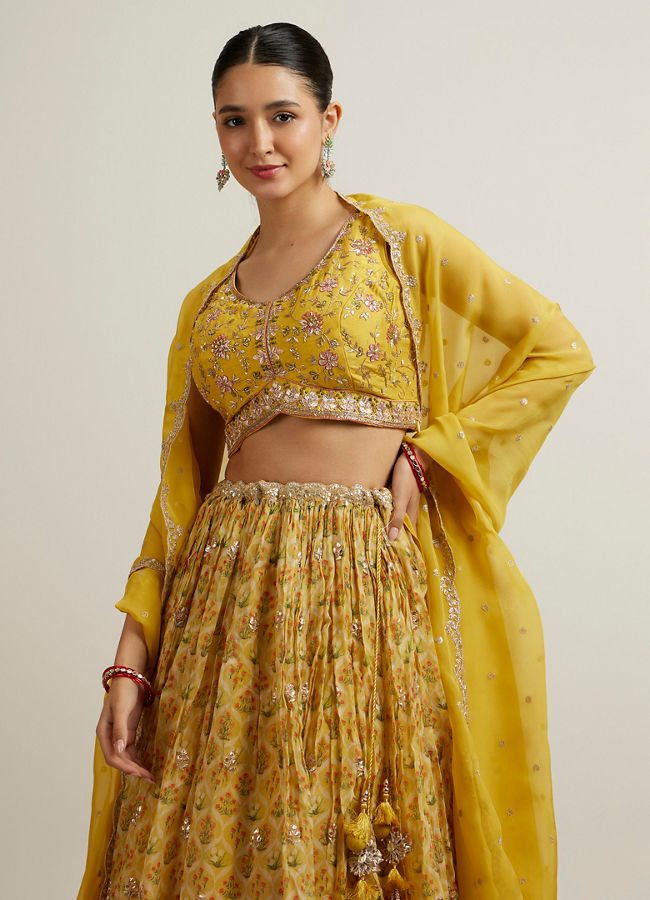 alt message - Mohey Women Glistening Yellow Radiance Lehenga image number 1