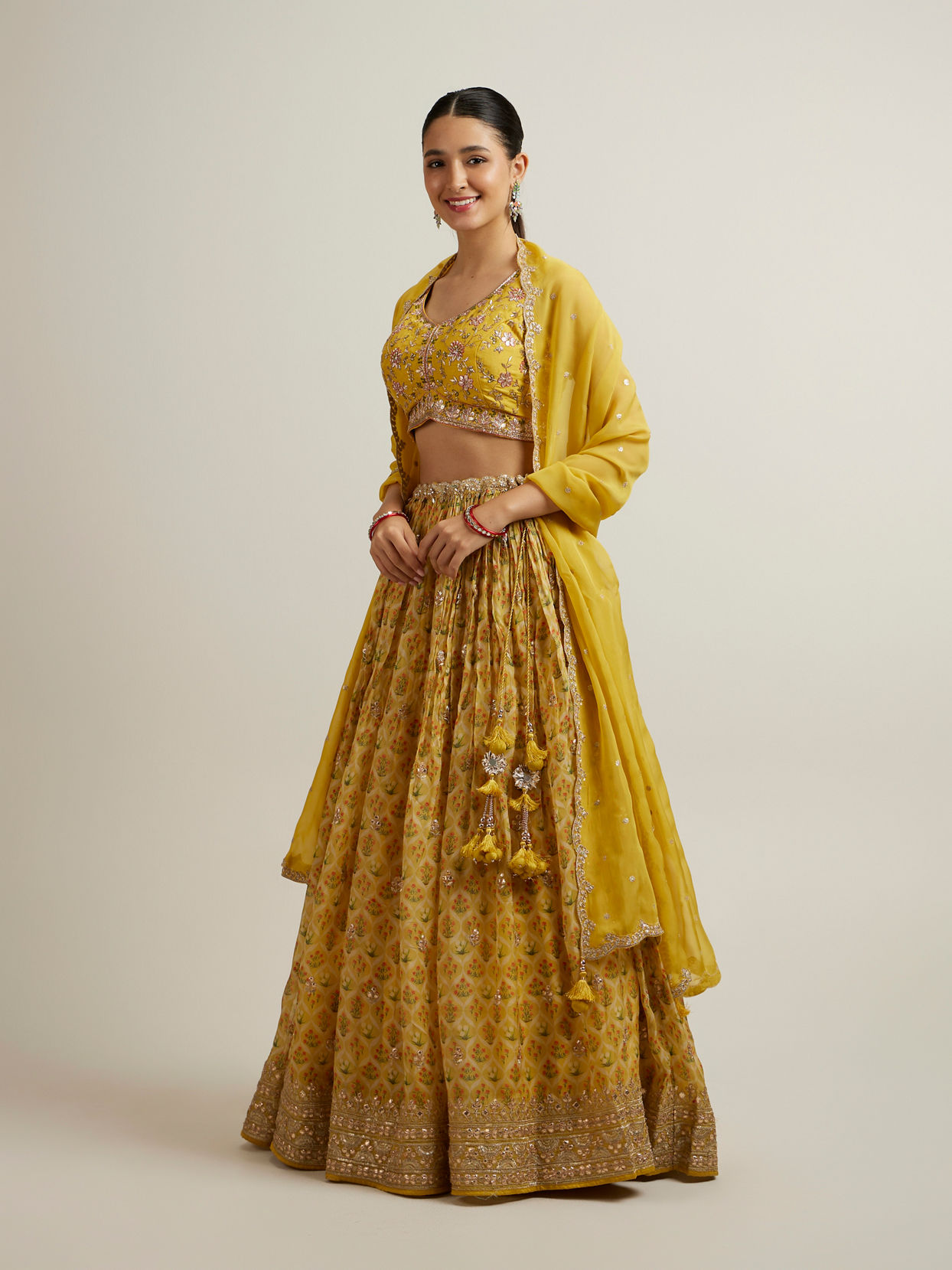 alt message - Mohey Women Glistening Yellow Radiance Lehenga image number 2