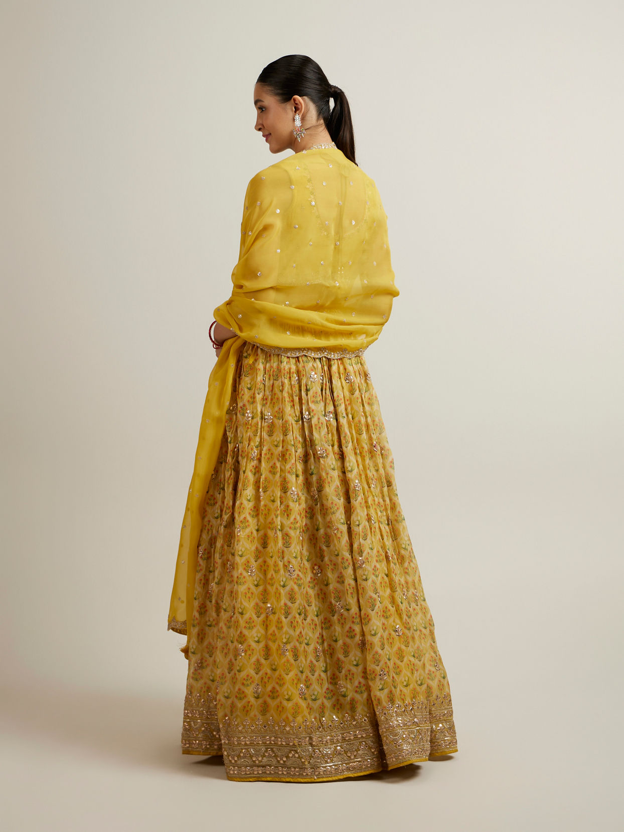 alt message - Mohey Women Glistening Yellow Radiance Lehenga image number 4