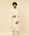 alt message - Manyavar Men Blush Pink Paisley Patterned Achkan Style Sherwani Set image number 0