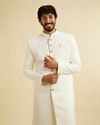 alt message - Manyavar Men Warm White Leaf Patterned Sherwani Set image number 0