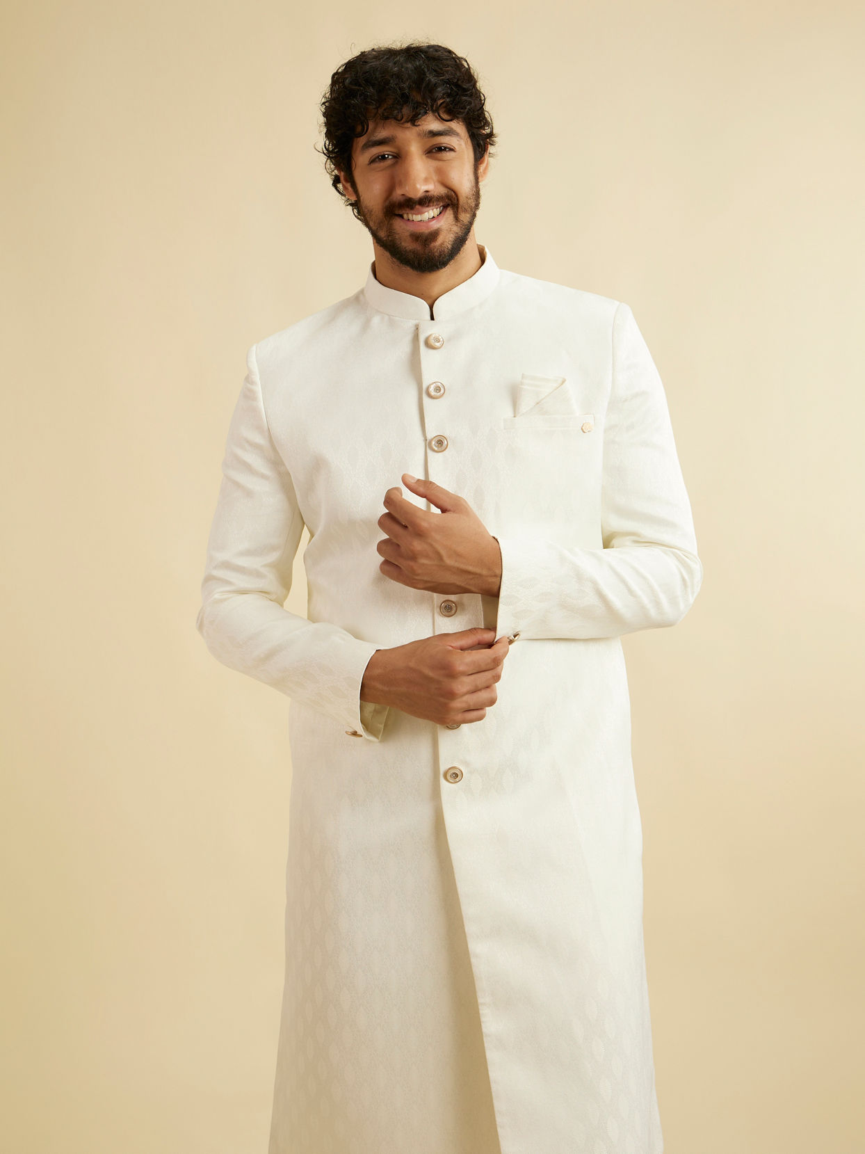 alt message - Manyavar Men Warm White Leaf Patterned Sherwani Set image number 0