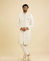 Manyavar Men Warm White Ogee Patterned Sherwani Set with Embellished Collar