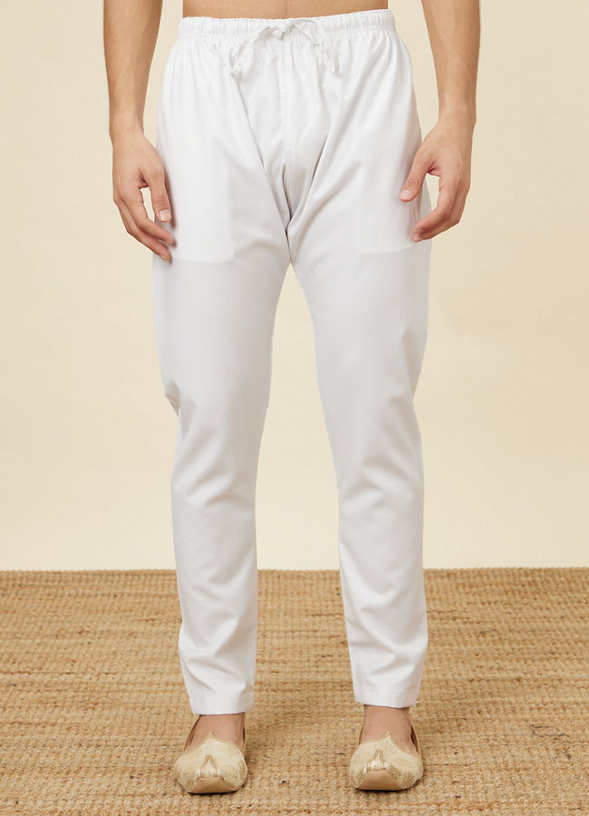 alt message - Manyavar Men Daisy White Pencil Cut Pajama image number 0