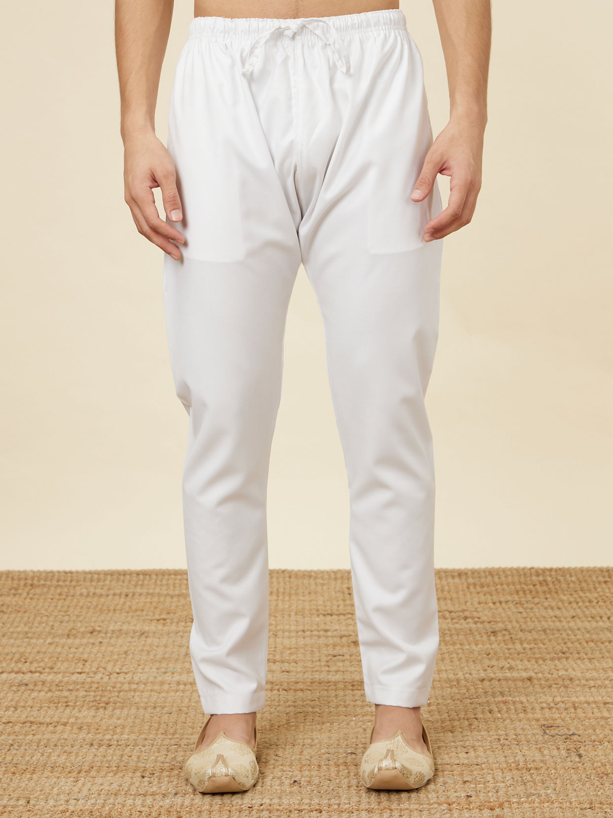 alt message - Manyavar Men Daisy White Pencil Cut Pajama image number 0