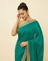 Mohey Women Teal Green Saree with Geometrical Patterned Borders