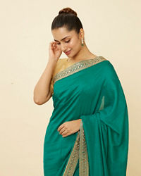 alt message - Mohey Women Teal Green Saree with Geometrical Patterned Borders image number 1