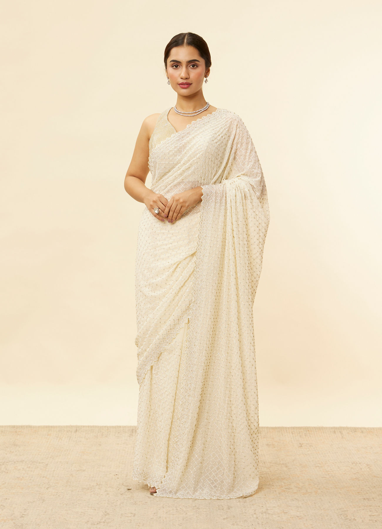 Mohey Women Ivory White Lattice Patterned Stone Work Saree