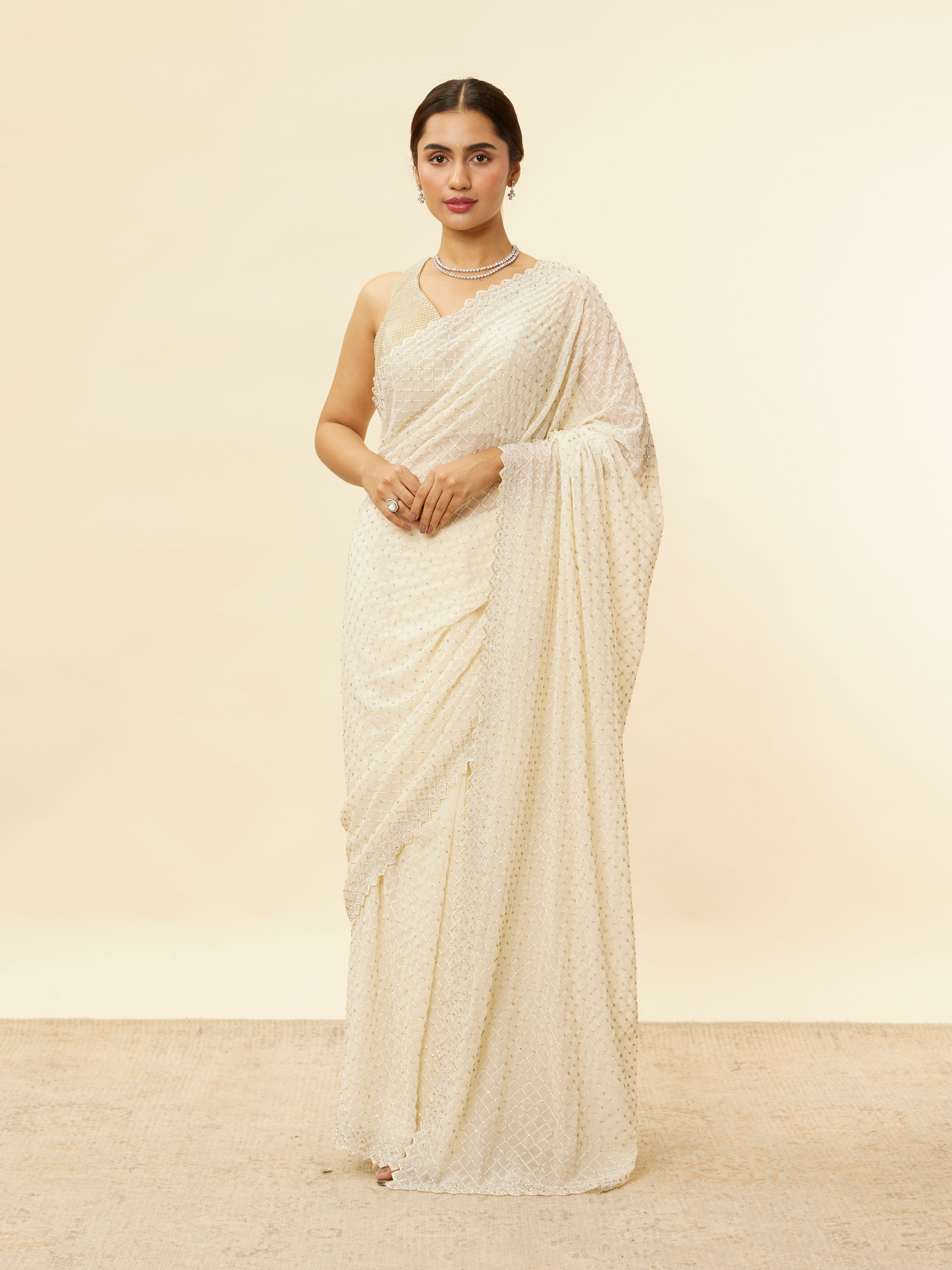 Mohey Women Ivory White Lattice Patterned Stone Work Saree