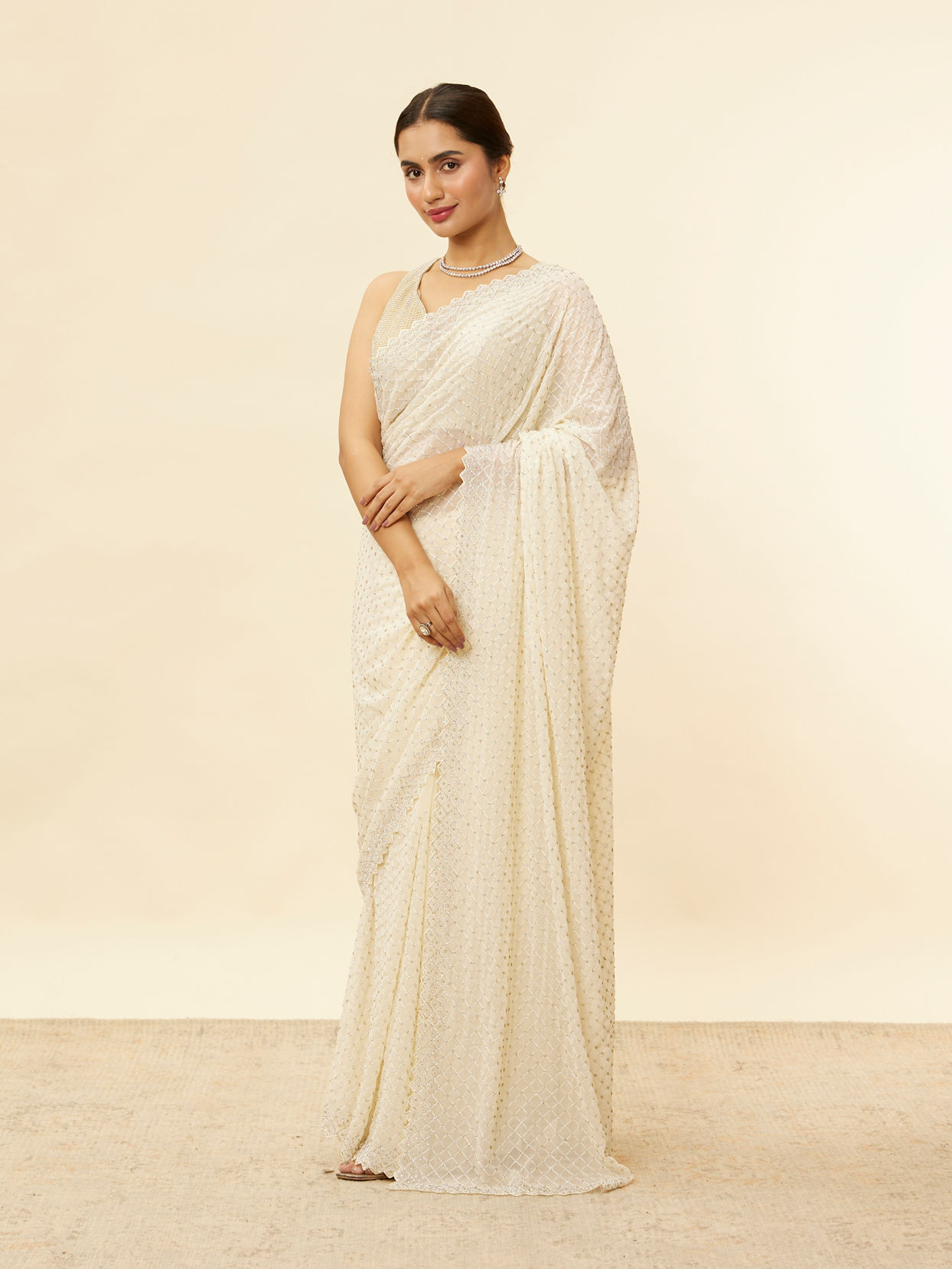 Mohey Women Ivory White Lattice Patterned Stone Work Saree
