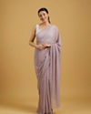 alt message - Mohey Women Dazzling Purple Georgette Saree image number 0