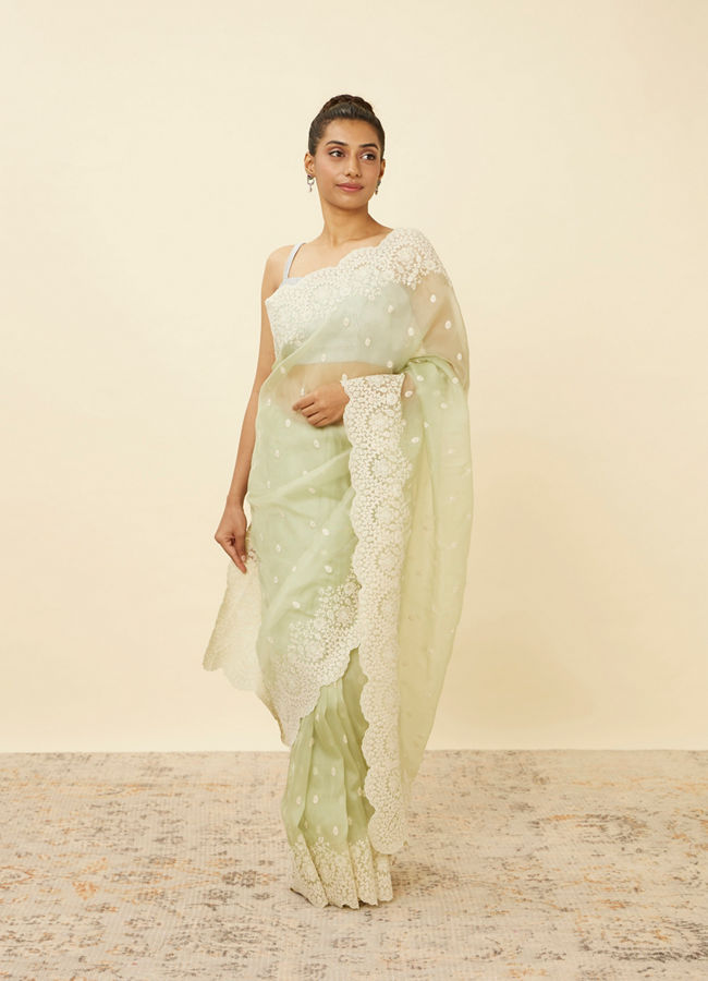 alt message - Mohey Women Pistachio Green Saree with Floral Vine Patterned Borders image number 0