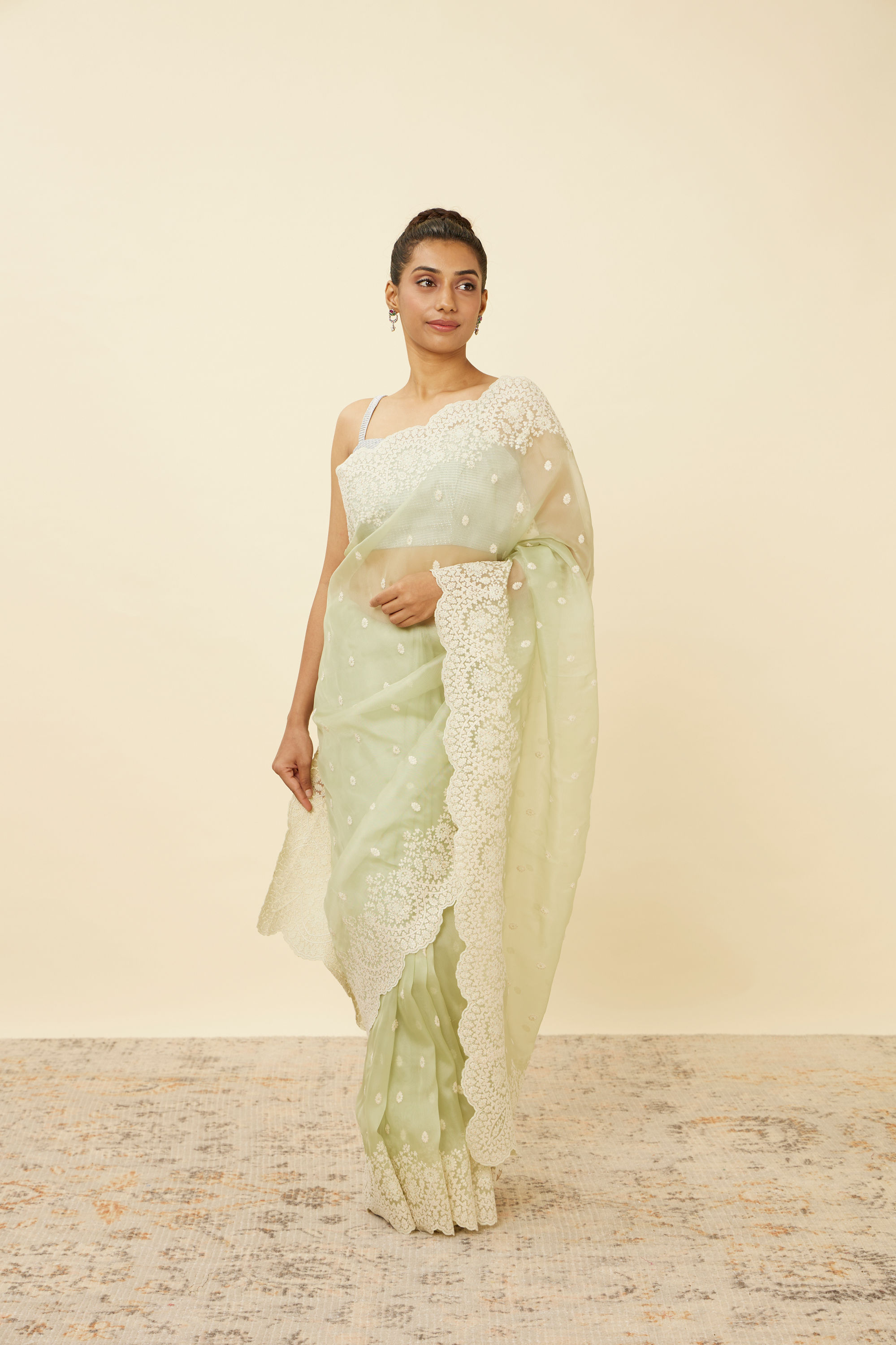 Mohey Women Pistachio Green Saree with Floral Vine Patterned Borders