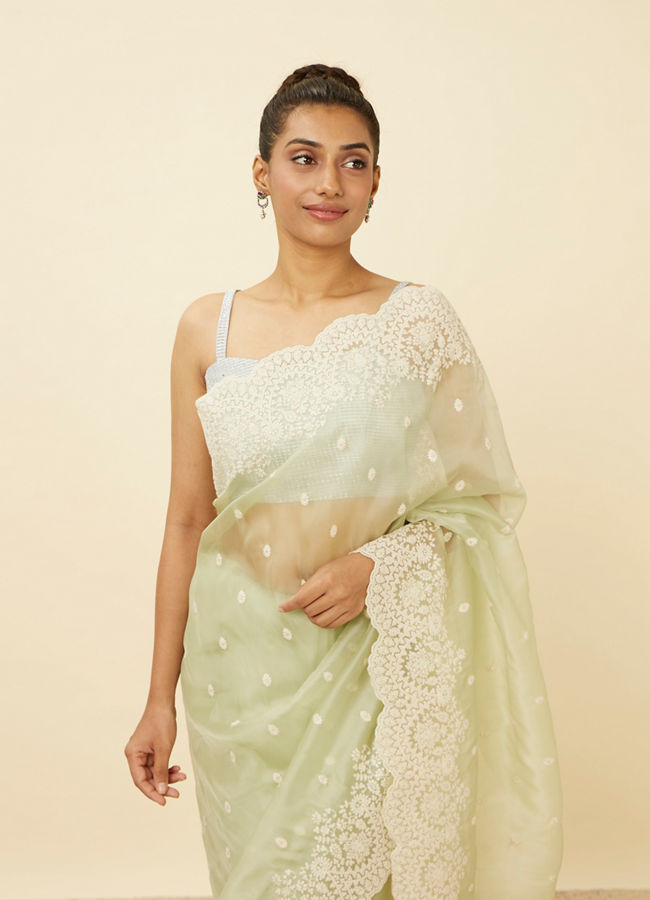 alt message - Mohey Women Pistachio Green Saree with Floral Vine Patterned Borders image number 1