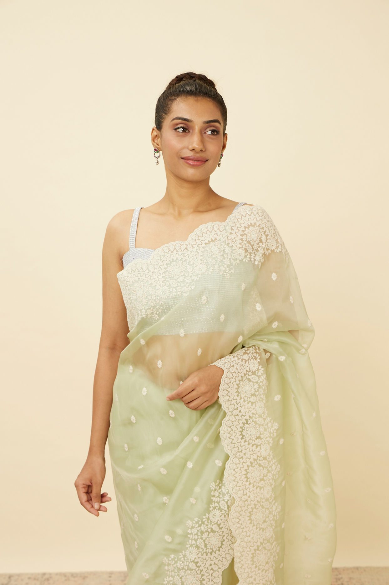 alt message - Mohey Women Pistachio Green Saree with Floral Vine Patterned Borders image number 1