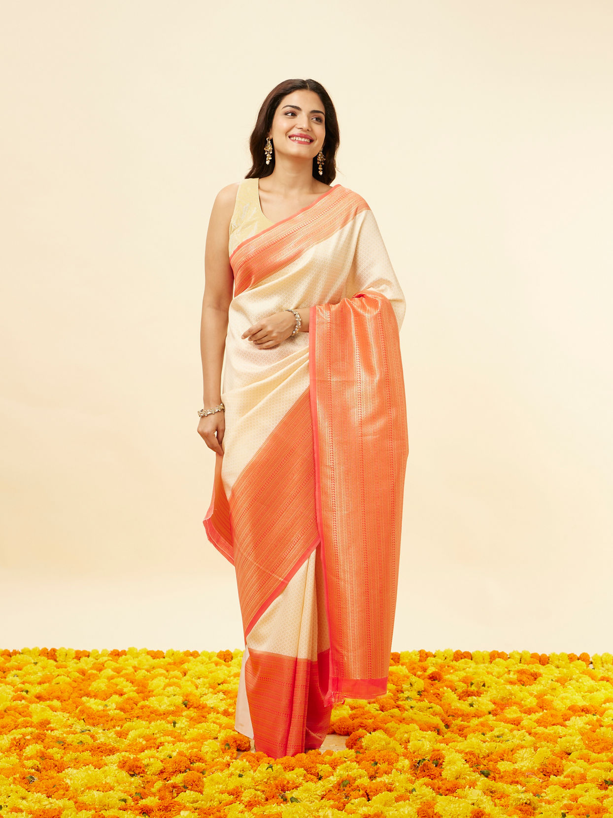 Cream Saree with Multicolour Floral Woven Panels, Red Zari Border & Tassel Pallu