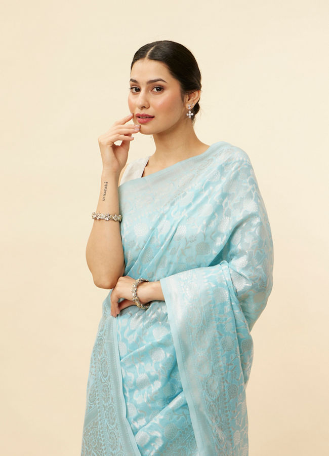 alt message - Mohey Women Sky Blue Floral Zari Work Saree image number 1