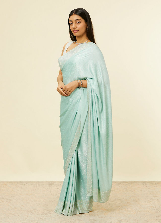 alt message - Mohey Women Light Blue Stone Embellished Saree image number 3