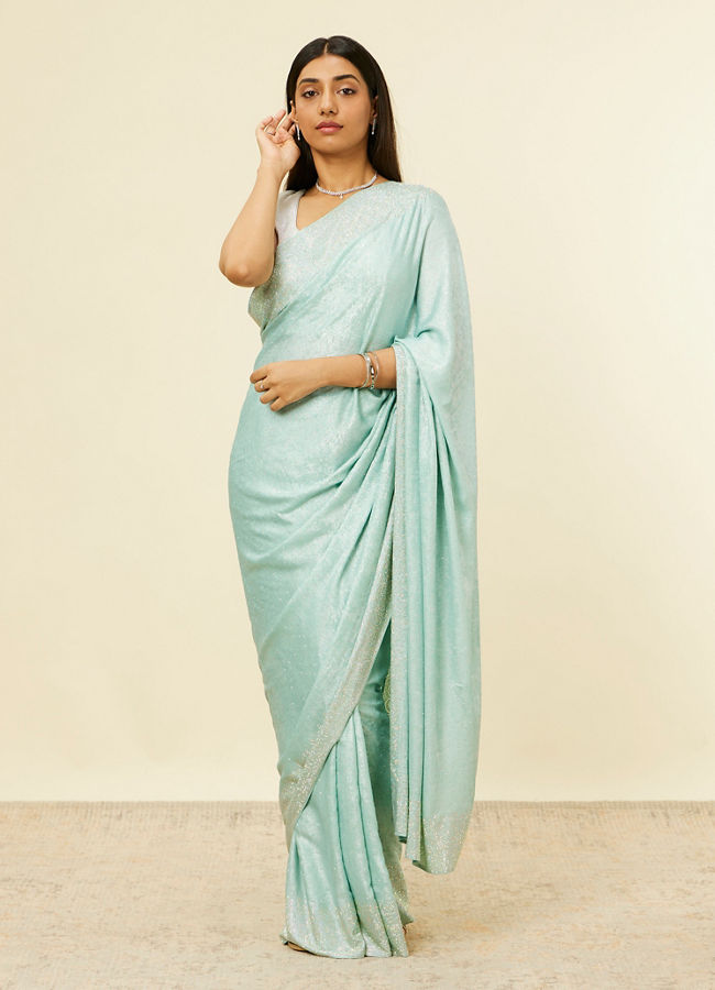 alt message - Mohey Women Light Blue Stone Embellished Saree image number 0