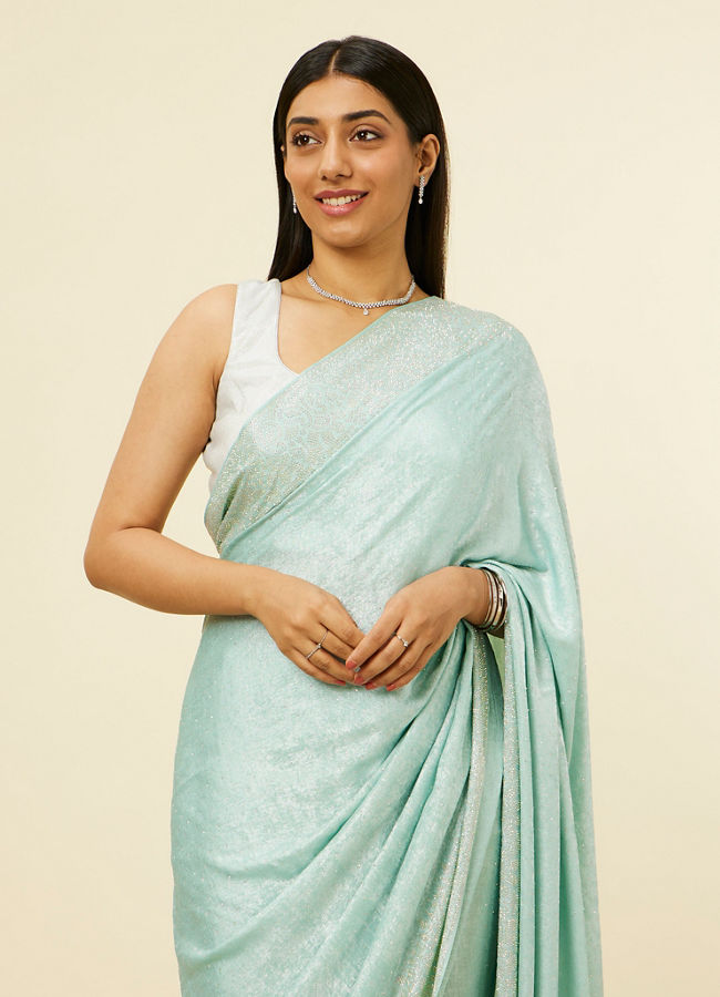 alt message - Mohey Women Light Blue Stone Embellished Saree image number 1