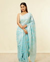 alt message - Mohey Women Light Blue Floral Zari Work Saree image number 0