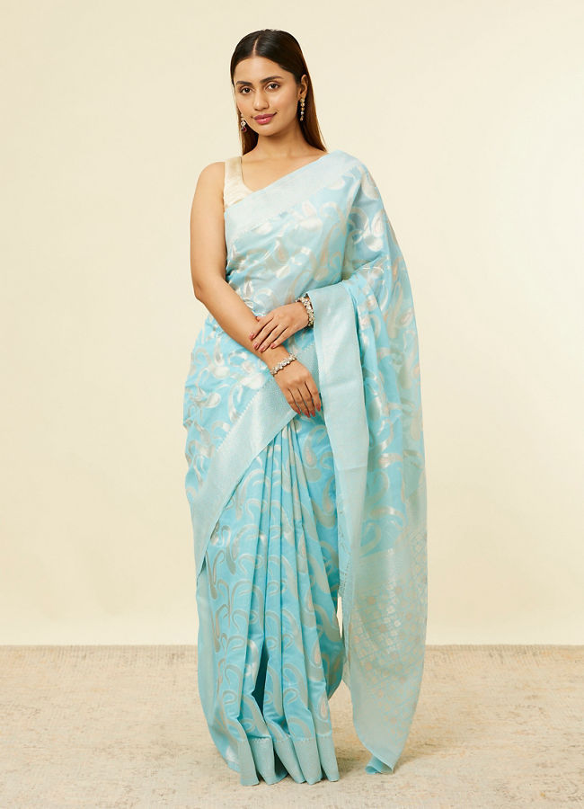 alt message - Mohey Women Light Blue Floral Zari Work Saree image number 0