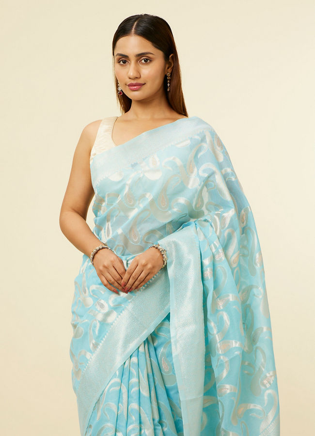 alt message - Mohey Women Light Blue Floral Zari Work Saree image number 1