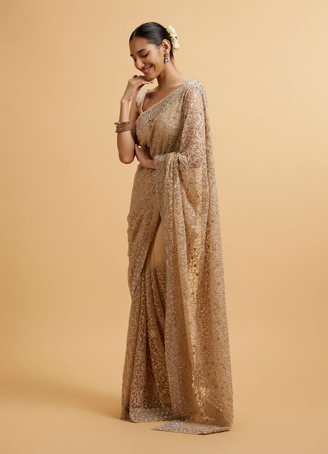 alt message - Mohey Women Beige Bel Buti Patterned Stone Embellished Saree image number 2