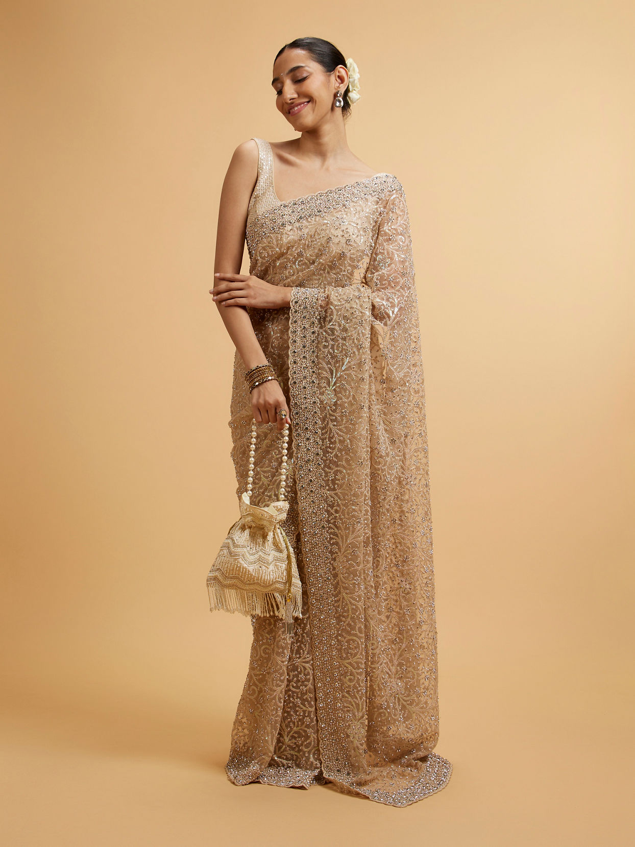 alt message - Mohey Women Beige Bel Buti Patterned Stone Embellished Saree image number 0