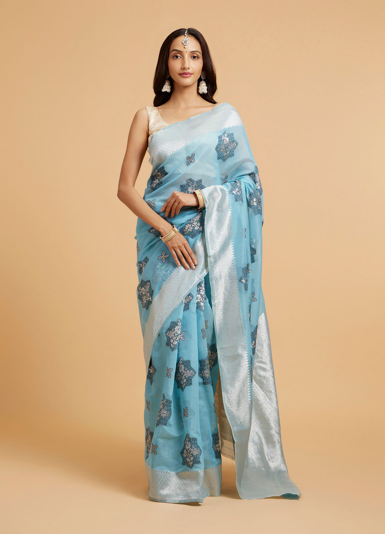 Mohey Women Turquoise Blue Floral Motifs in Zari Work Saree