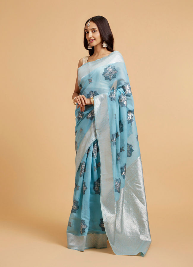 Mohey Women Turquoise Blue Floral Motifs in Zari Work Saree
