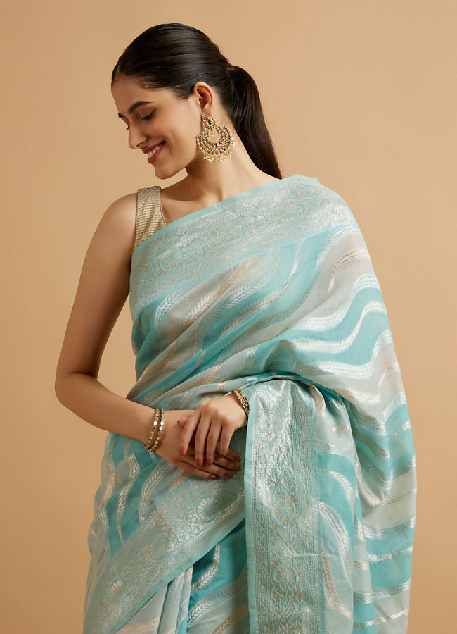 alt message - Mohey Women Light Blue Leaf Patterned Saree with Floral Motifs image number 1