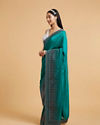 Mohey Women Rama Green Stone Embellished Saree