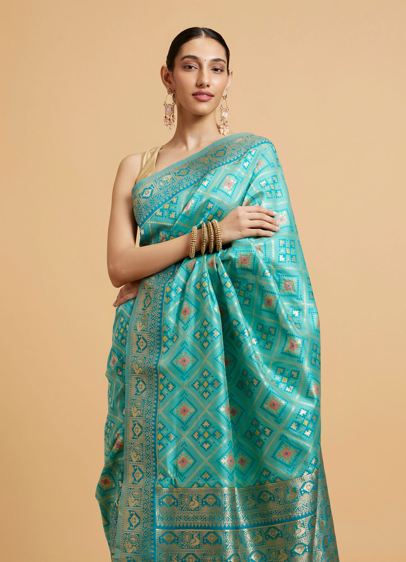 Mohey Women Turquoise Blue Chowkadi Motif Saree with Peacock Motifs on Border