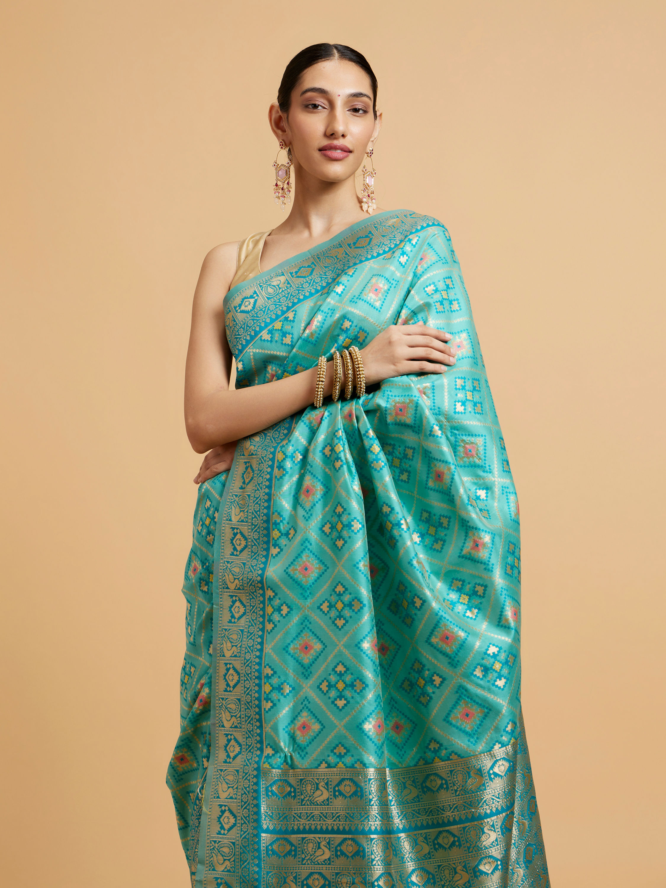 Mohey Women Turquoise Blue Chowkadi Motif Saree with Peacock Motifs on Border