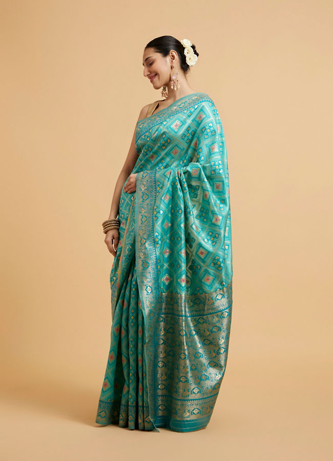 Mohey Women Turquoise Blue Chowkadi Motif Saree with Peacock Motifs on Border