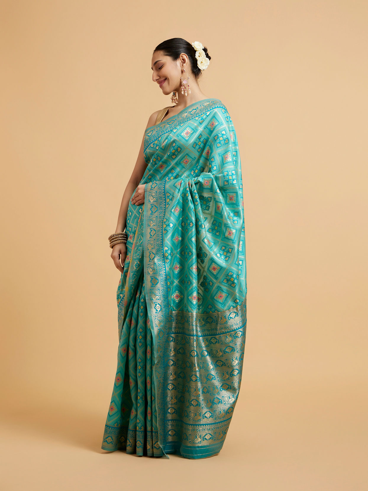 Mohey Women Turquoise Blue Chowkadi Motif Saree with Peacock Motifs on Border