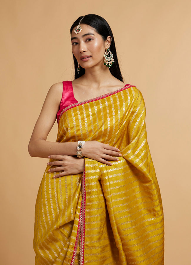 alt message - Mohey Women Mustard Yellow Linear Leaf Patterned Saree image number 1