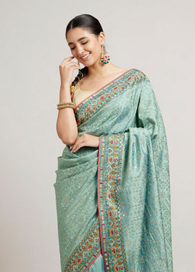 alt message - Mohey Women Sea Green Floral & Grid Patterned Saree with Sequin Work image number 1